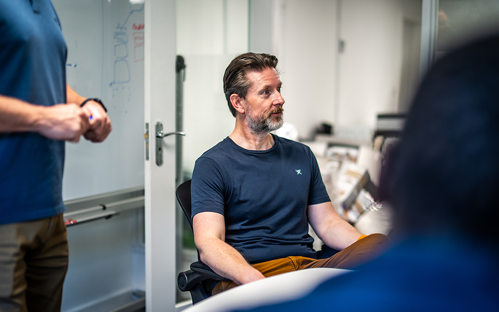 Steve Adams engaged in a meeting with the Mattress Online Operations Team.
